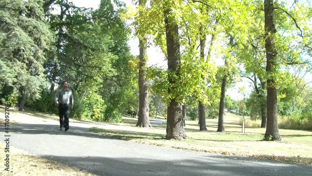 Man Walking Through Park Man Walking Through Park