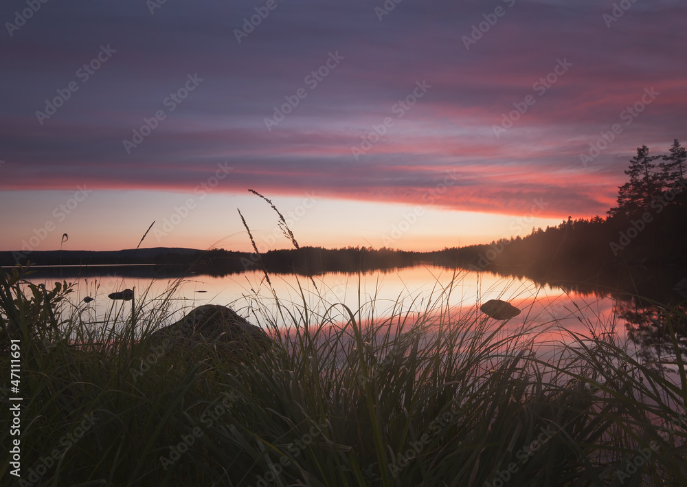 Misty morning, sun rising over a Lake in Sweden