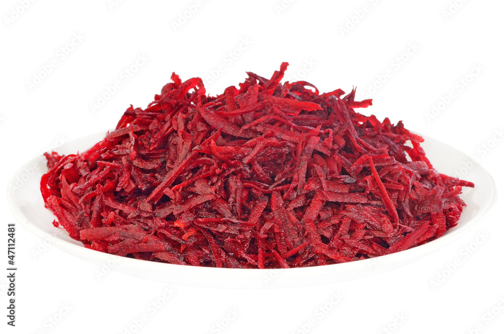 Fototapeta premium Grated raw beet on a plate