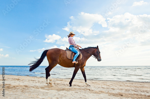 girl with horse on seacoast © Igor Normann