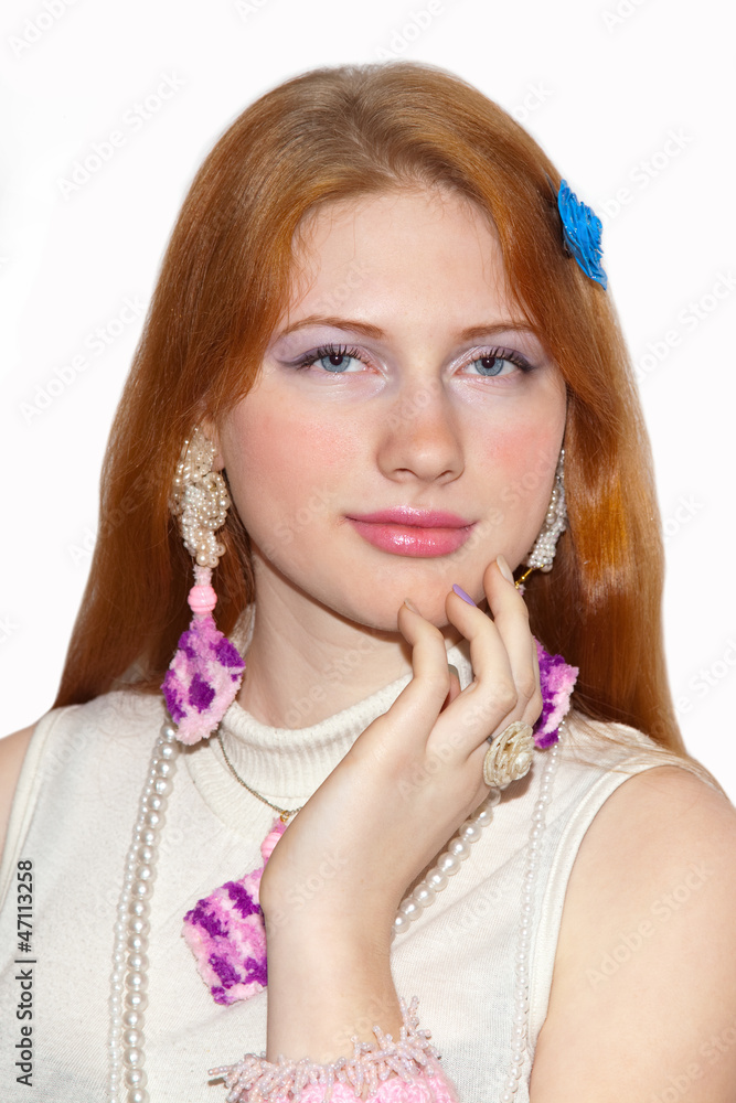 Redhead girl showing jewelry