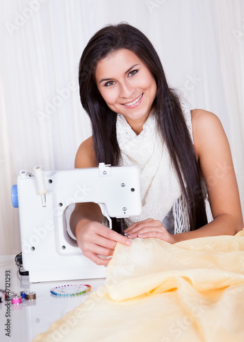 Woman working with her sewing machine