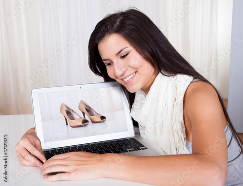Woman shopping online for shoes
