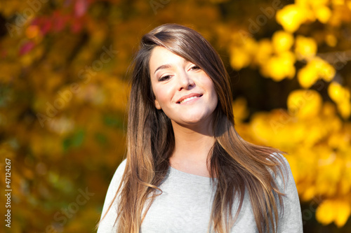 Beautiful woman in an autumn park