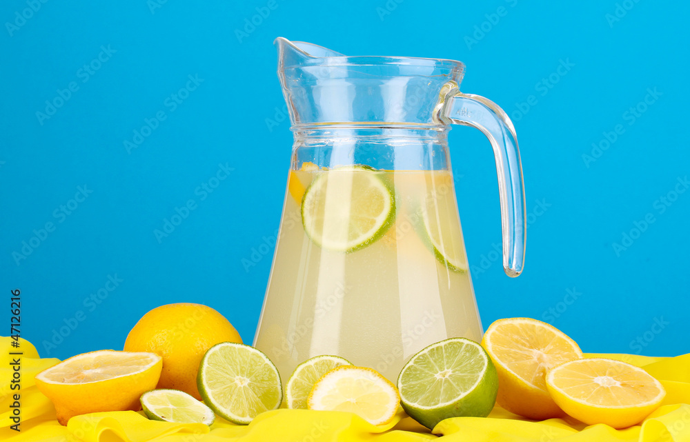 Citrus lemonade in glass pitcher of citrus around Citrus lemonade in glass pitcher of citrus around