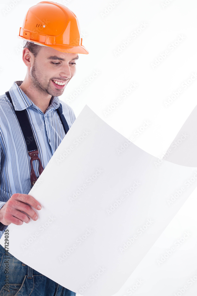 Male architect looking at blueprints against white background Male architect looking at blueprints against white background
