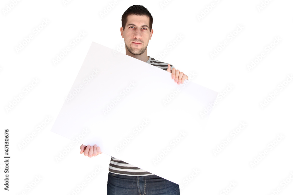 Attractive young man holding blank Attractive young man holding blank