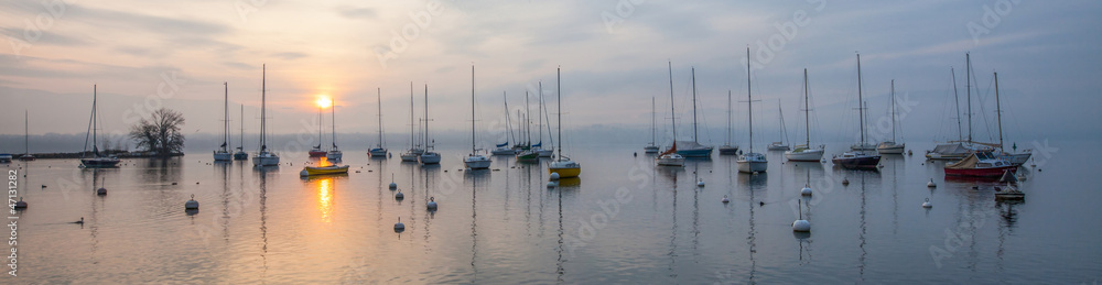 Panoramic view of Boats and Sunrise