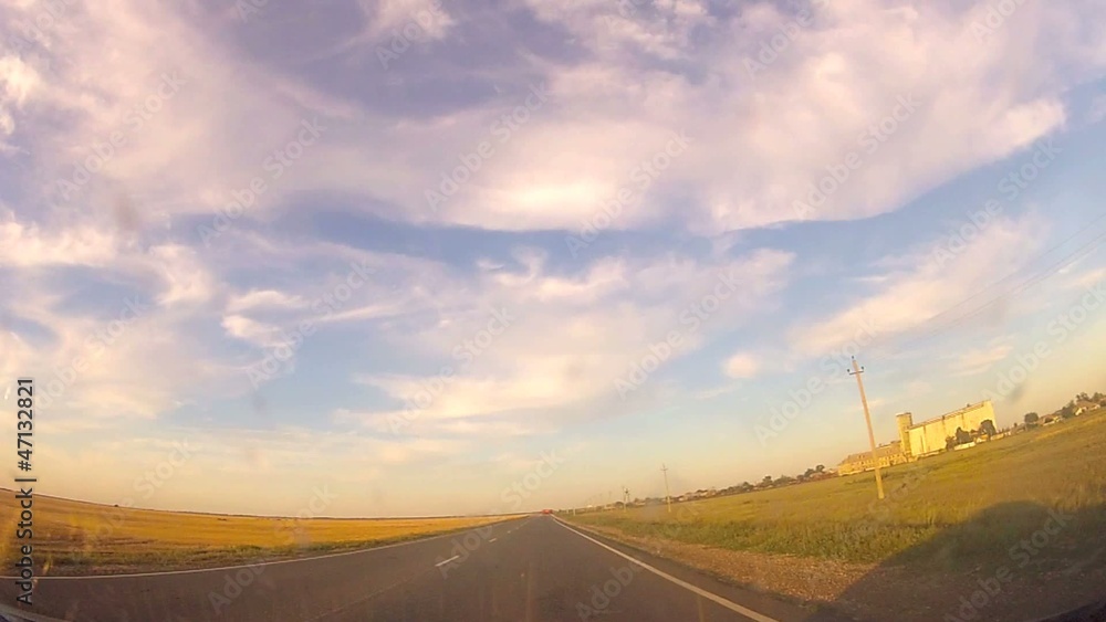 Driving a vehicle during sunset Driving a vehicle during sunset