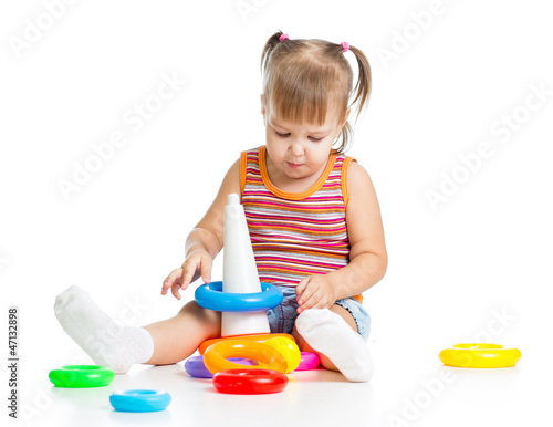 little child playing with c...