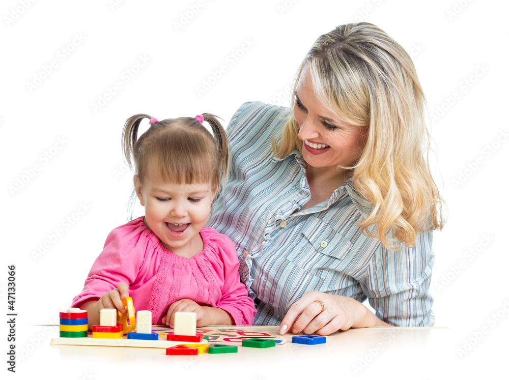 mother and her child playing with colorful puzzle toy mother and her child playing with colorful puzzle toy