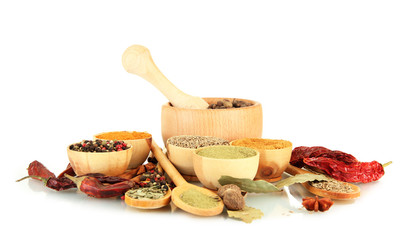 Fototapete Gewürze wooden mortar, bowls and spoons with spices isolated on white  © Africa Studio