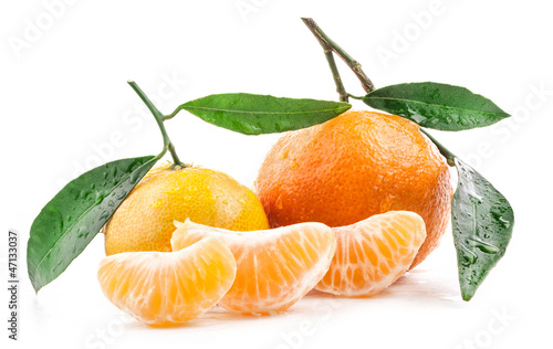Tangerines with green leaves isolated on white background