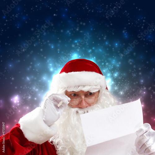 Santa with christmas letter © Sergey Nivens
