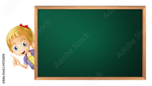 a girl and a green board