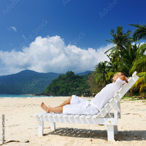 Man relaxing on a beach