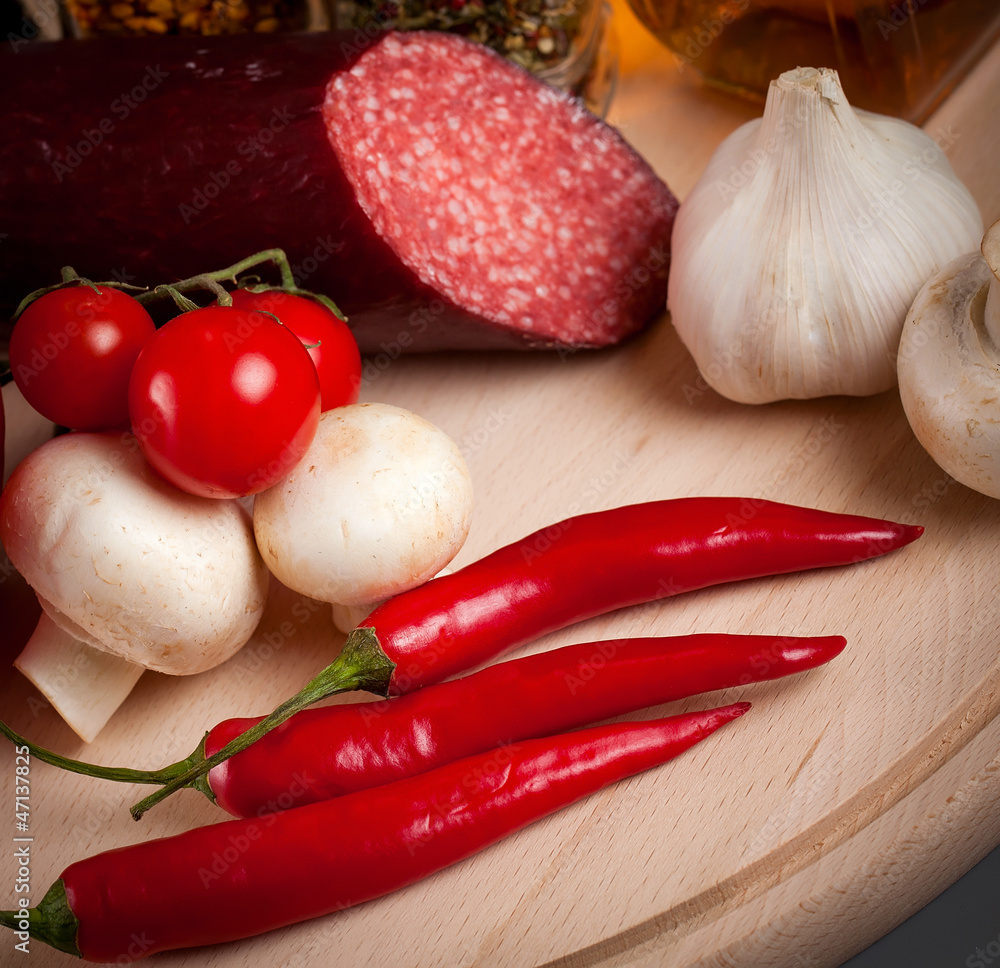 set of food items on a wooden cutting board. isolated set of food items on a wooden cutting board. isolated