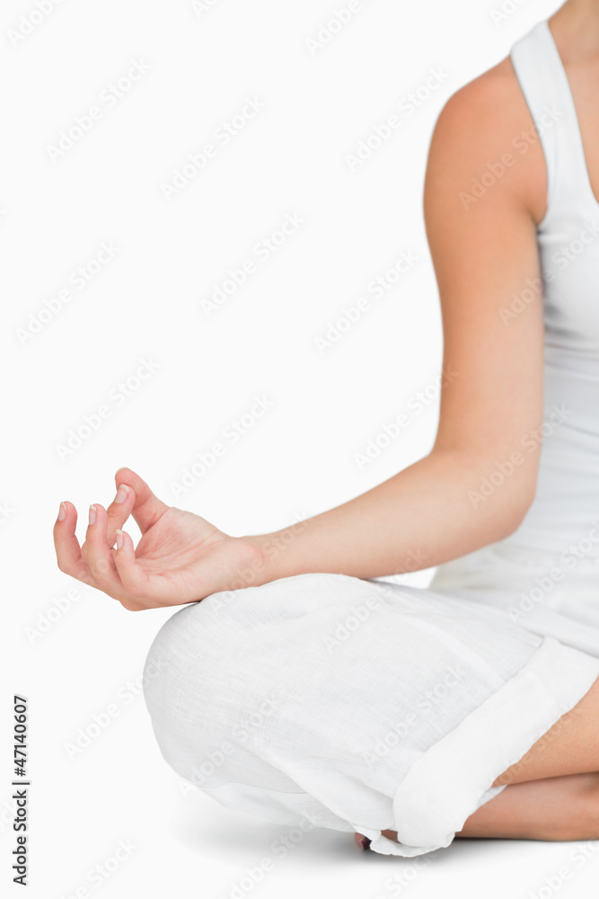 Woman doing yoga while sitting
