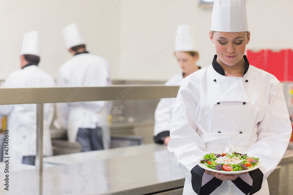 Chef presenting her salad