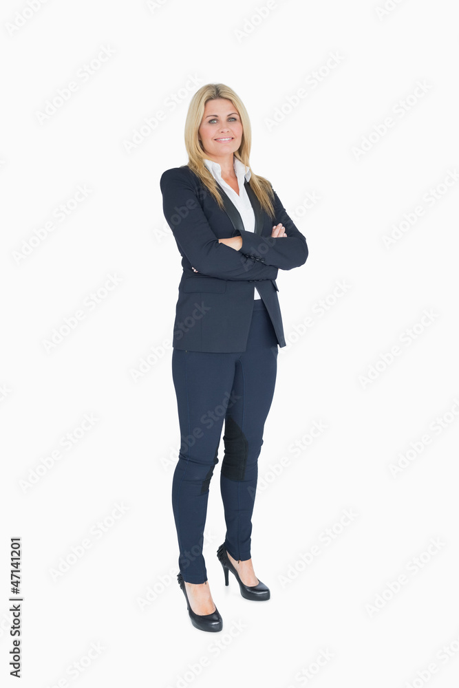 Cheerful business woman crossing her arms Cheerful business woman crossing her arms