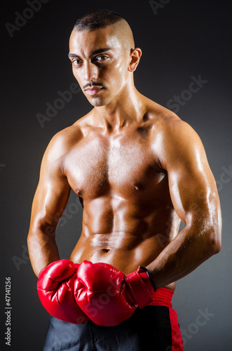 Muscular boxer in studio shooting