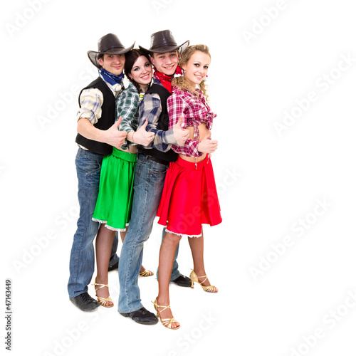 Smiling cowboys and cowgirls with thumbs up gesture