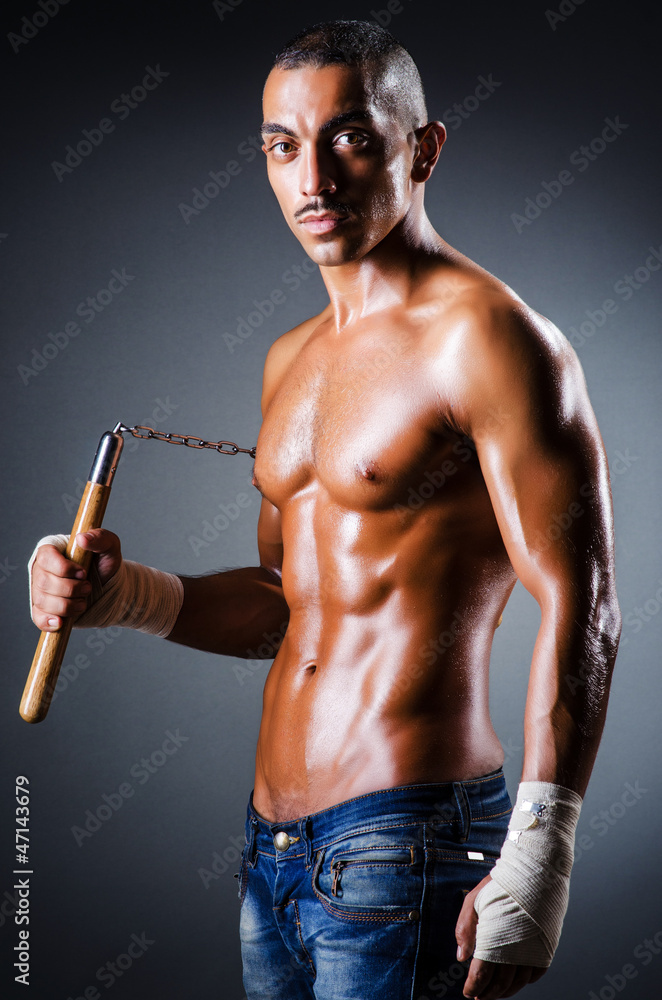 Strong man with nunchaku Strong man with nunchaku