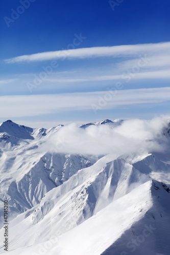 Snow mountains in clouds