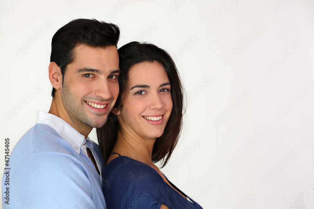 Young in love couple standing on white background Young in love couple standing on white background