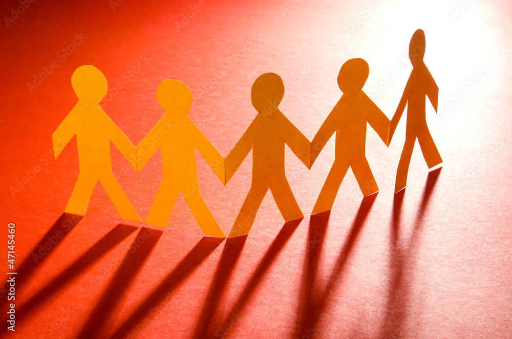 Paper people in teamworking concept Paper people in teamworking concept
