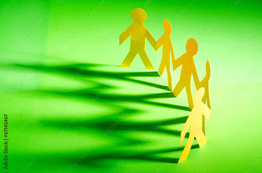 Paper people in teamworking concept Paper people in teamworking concept