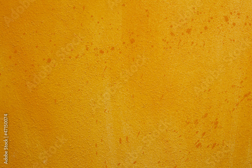 Yellow orange wall background with scratches