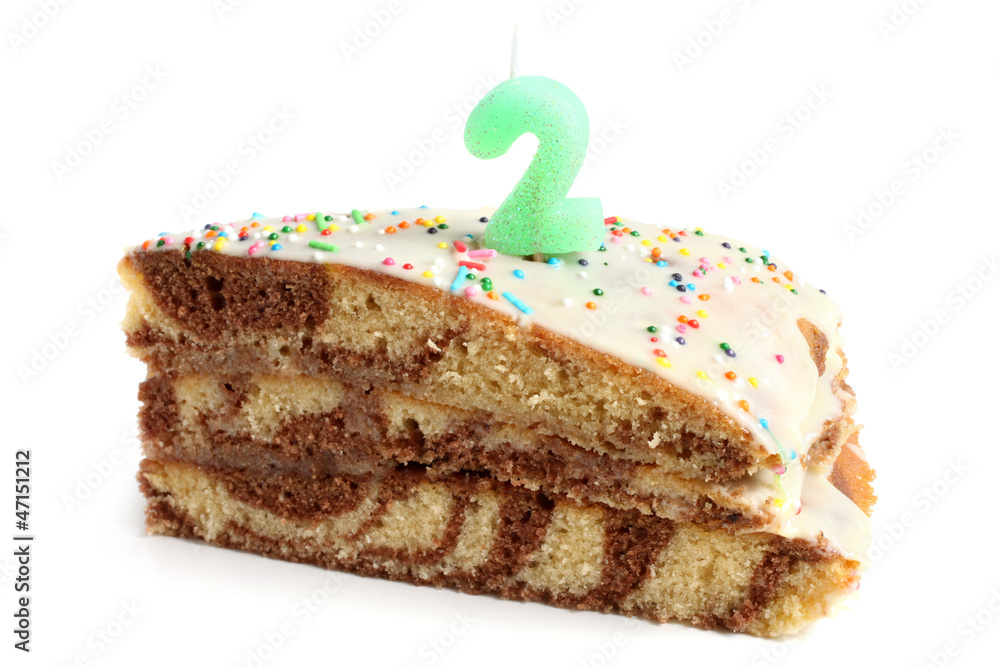 Slice of birthday cake with number two candle Slice of birthday cake with number two candle