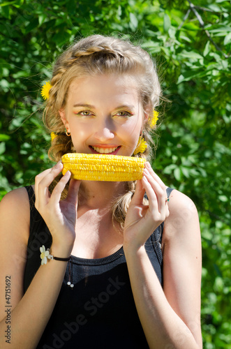 woman eating corn-cob