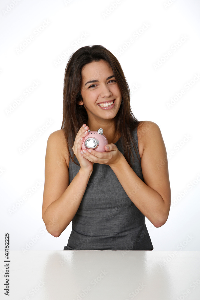 Portrait of beautiful woman holding piggy bank Portrait of beautiful woman holding piggy bank