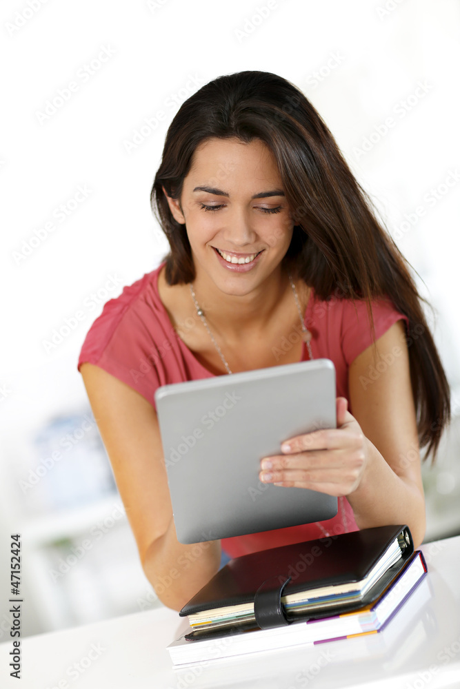 College student using electronic tablet