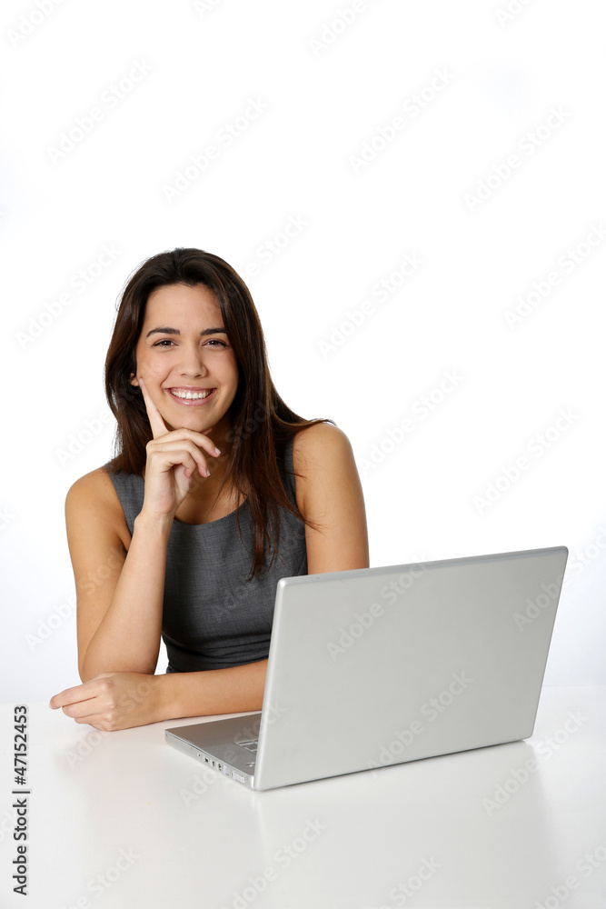 Cheerful young woman in front of laptop Cheerful young woman in front of laptop