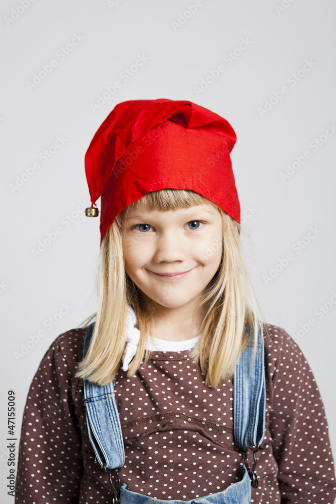 Smiling girl wearing Christmas hat Smiling girl wearing Christmas hat