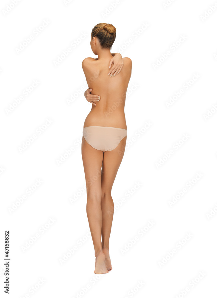 Fototapeta premium rear view of beautiful topless woman in panties