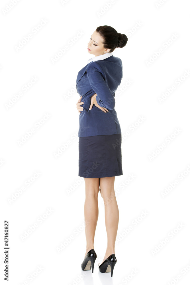 Business woman with back pain after long work. Business woman with back pain after long work.