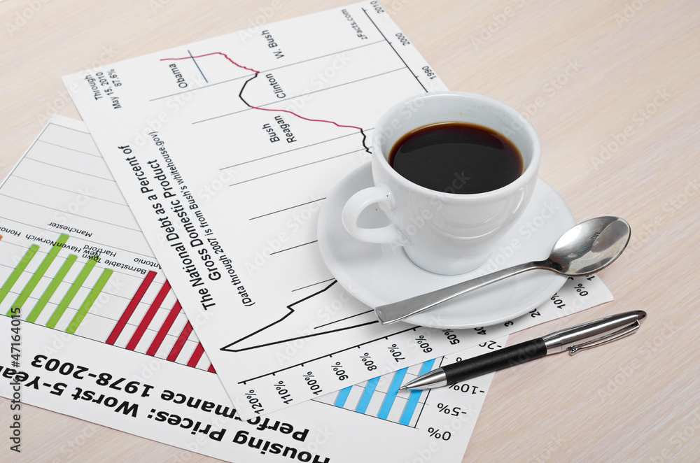Accounting. Cup of coffee on document. chart and diagram Accounting. Cup of coffee on document. chart and diagram