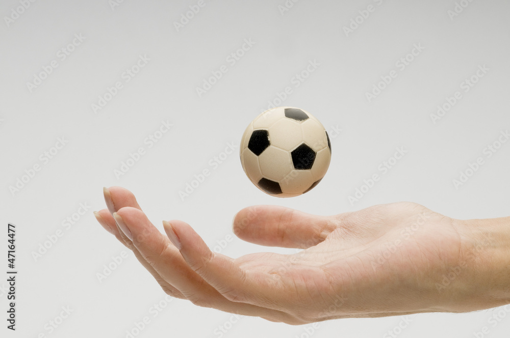 Fototapeta premium Soccer ball on female hand