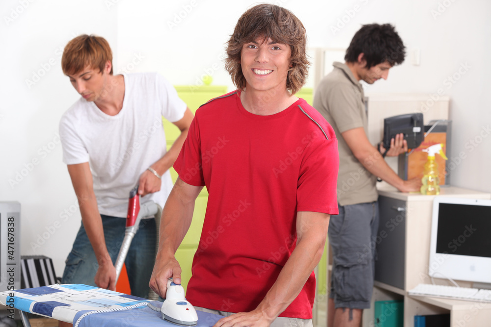 Fototapeta premium Boys cleaning the house