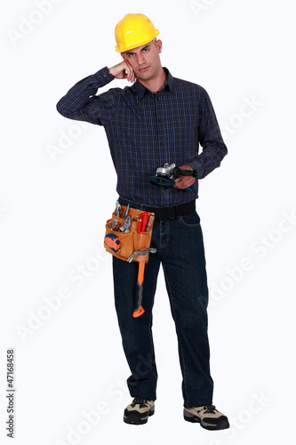 Woodworker holding a sander