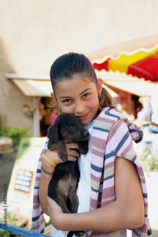 Little girl holding dog Little girl holding dog