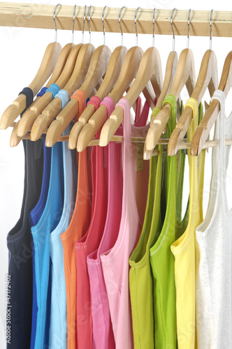 Colorful different peignoir on wooden hangers