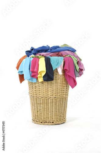Full of colorful shirts in a wicker basket