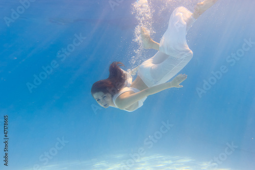 Wallpaper Mural Woman in a white dress underwater in swimming pool Torontodigital.ca