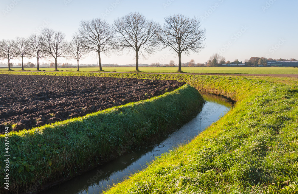Obraz premium Plowed field in autumn