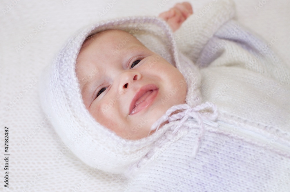 Portrait of the crying baby in a knitted suit (2 months) Portrait of the crying baby in a knitted suit (2 months)